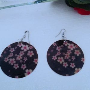 Black and reddish pink floral circle earrings